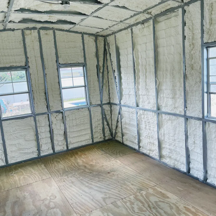 Closed-cell spray foam insulation applied to wall cavities in a residential project in Northport